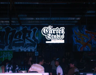 a group of people standing in front of a wall covered in graffiti