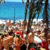Daytime Clubbing In Ibiza: Beach Clubs Worth Your Time A large group of people on a beach