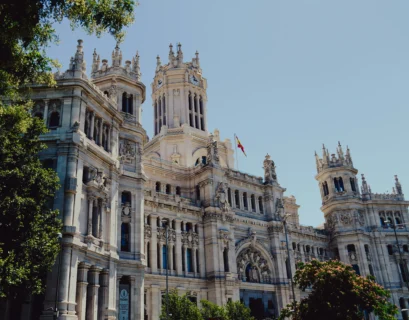 a large white building with a clock tower