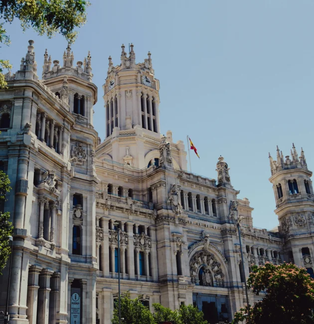 a large white building with a clock tower