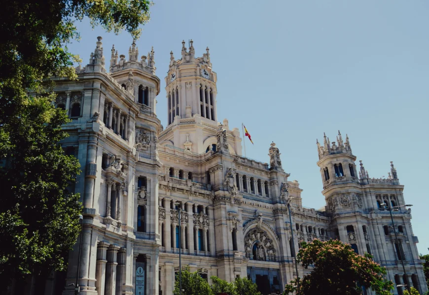 a large white building with a clock tower