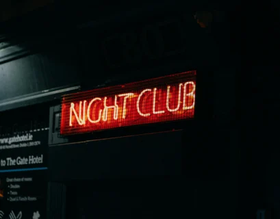a neon sign that says night club on it