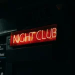 a neon sign that says night club on it
