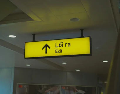 A yellow sign hanging from the ceiling of a building