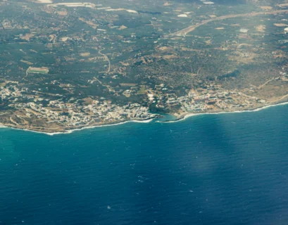 an aerial view of a city and a body of water