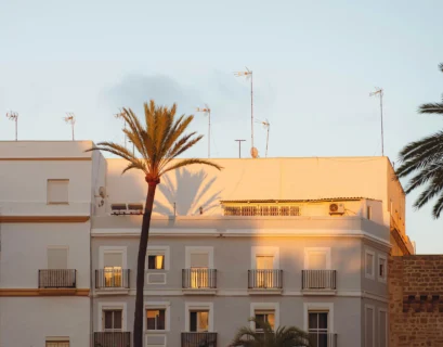 Buildings are bathed in golden hour sunlight.