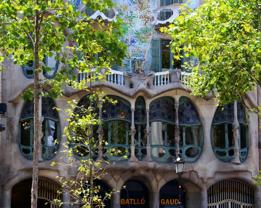 gray building beside trees