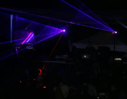 three blue stage lights inside black room