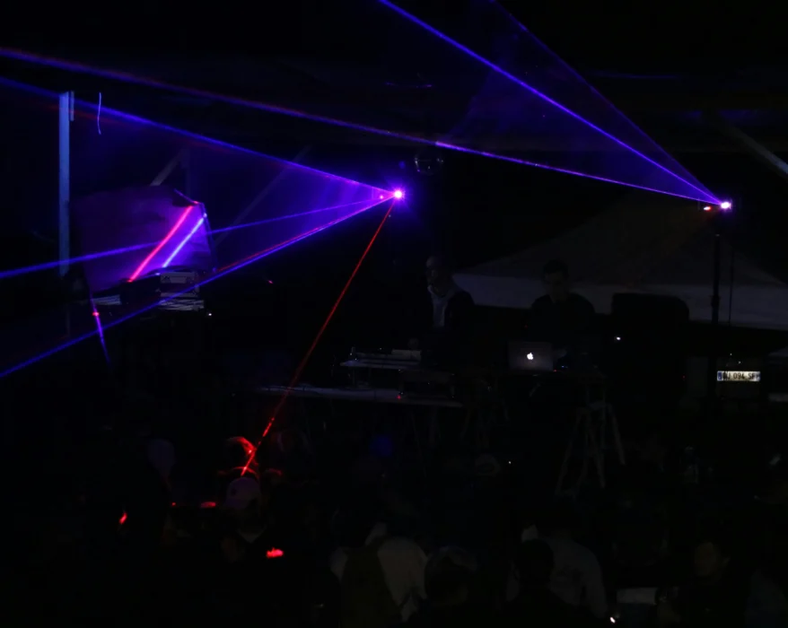 three blue stage lights inside black room