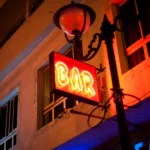 turned-on red Bar neon sign at night